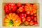 Mature tomatoes put on a wood tray