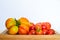 Mature tomatoes put on a wood tray