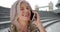 Mature white lady in London answers phone call from friend