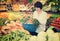 Mature woman buying fresh vegetables