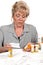 Mature woman checking prescription