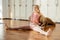 Mature woman doing Stretching Exercises On Yoga Backbend Bench in studio