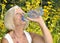 Mature woman drinking water.