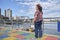 Mature woman enjoying a sunny summer day at La Boca, Buenos Aires, Argentina