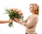 Mature woman gets bouquet of roses, Mother`s Day