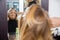 Mature Woman Having Hair Dyed At Beauty Parlor