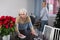 Mature woman and her adult daughter clean up the apartment