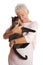 Mature woman holding cat in her arms