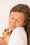 Mature woman holding guinea pig pets