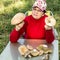 mature woman holding in her hands a big white mushroom freshly plucked in nature. Focus on mushrooms