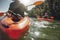 Mature woman kayaking in lake on a sunny day