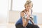 Mature Woman Lifting Dumbbell At Home