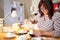 Mature Woman Making Candles At Home