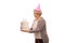 Mature woman with a party hat holding a birthday cake