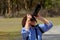 Mature woman photographing wildlife