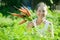 Mature woman picking carrot