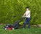 Mature Woman Preparing to work on Grass Yard