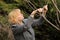 Mature woman pruning fig tree