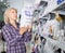 Mature woman purchasing pet food in petshop