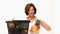 Mature woman putting fruit into a bowl