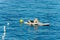 Mature Woman Relaxes on Stand Up Paddle Board in the Sea - Liguria Italy
