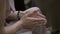 Mature woman sitting in the audience clapping their hands. Hands close up.