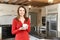 Mature Woman Standing In New Luxury Fitted Kitchen