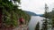 Mature woman standing on rock near riverside 4k