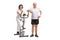 Mature woman on a stationary bike with a mature man leaning on i