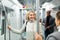 Mature woman talking with fellow traveler in subway car