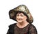 Mature woman in tapestry hat looking at camera