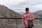 A mature woman on the top of Nordkette above the abyss. Austria