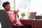 Mature Woman Using Laptop On Desk At Home