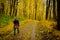 Mature woman walking Nordic Walk in a park