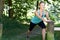 Mature Woman Warming Up Before Exercising In Countryside