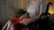 Mature woman in wheelchair resting from knitting, evening hobby, close up view