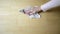 Mature woman wiping wooden floor at home