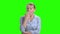 Mature woman is yawning on chroma key background.