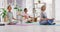 Mature women meditating in lotus pose with mudra hand gesture during a fitness class in a yoga studio. Calm, relaxed and