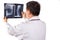 Matured Asian orthopedic medical doctor examining X-ray film