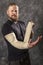 Matured man with bandaged hand studio portrait.