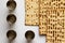 Matzah - Jewish bread for Passover. Next to four silver cups.