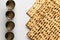 Matzah - Jewish bread for Passover. Next to four silver cups.