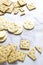 Matzo crackers, salty crackers with sesame seeds and flax seeds on a light background