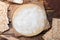 Matzos and raw dough on wooden table, flat lay