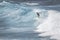 MAUI, HI - MARCH 10, 2015: Professional surfer rides a giant wave at the legendary big wave surf break \