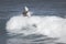 MAUI, HI - MARCH 10, 2015: Professional surfer rides a giant wave at the legendary big wave surf break \