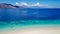 Maumere - A drone shot of a girl playing on the white sand beach