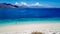 Maumere - A drone shot of a girl playing on the white sand beach