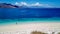 Maumere - A drone shot of a girl playing on the white sand beach